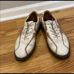 Gold and white golf shoes